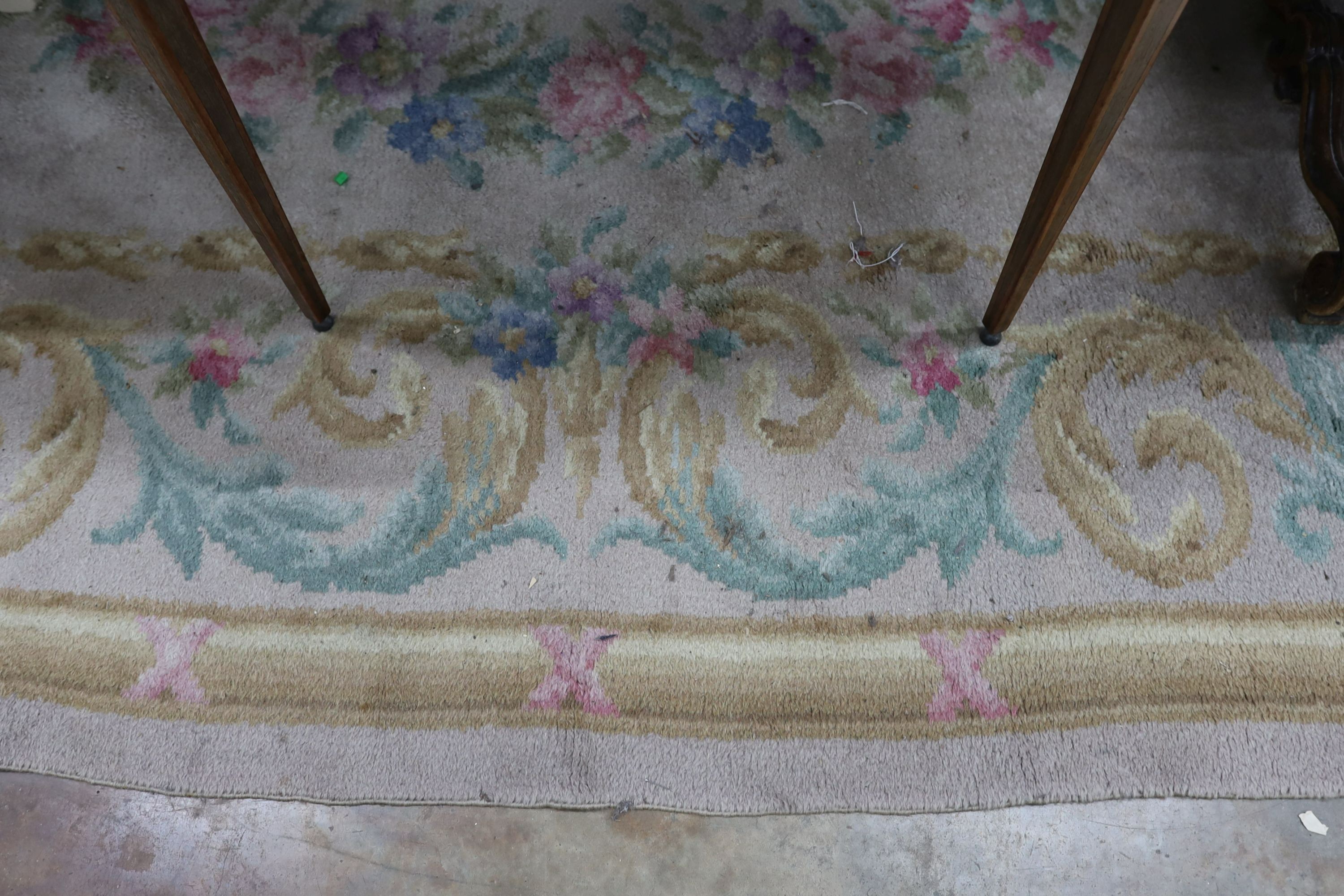An Aubusson style fawn ground wool carpet, 360 x 260cm